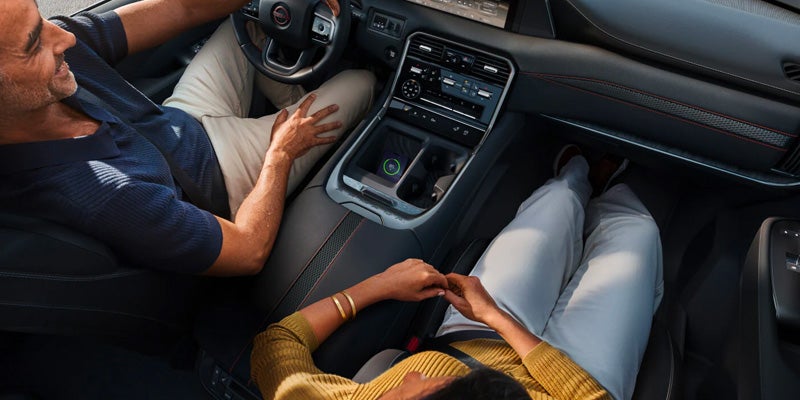 A driver and passenger in a top down view in the 2025 Nissan Armada in Pompano Beach, FL